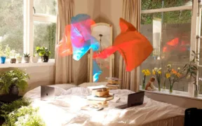 Persona sentada en una habitación, imagen ilustrativa de vivir solo en la ciudad